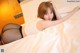 A woman laying on top of a bed in black stockings.